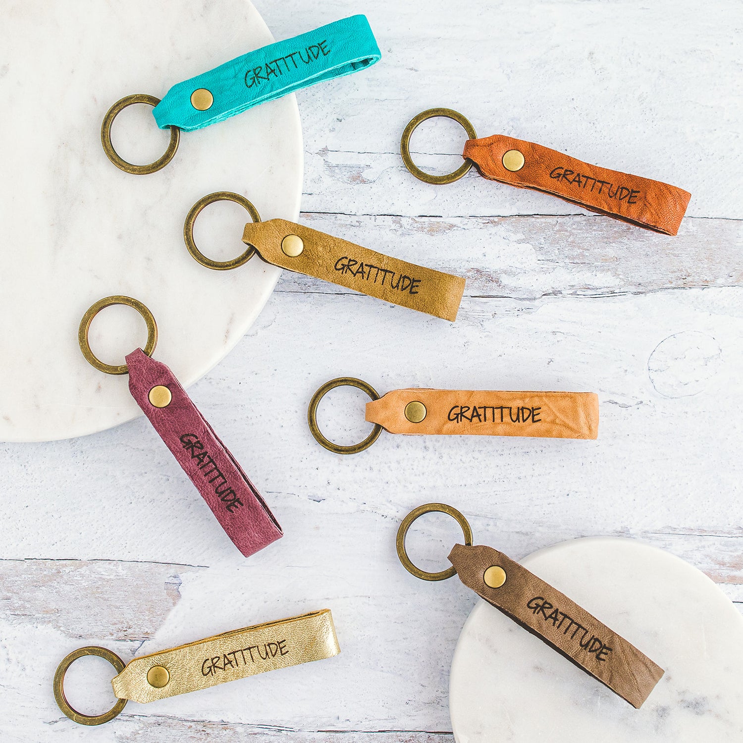 Assorted colors of Leather Keychains with Gratitude print